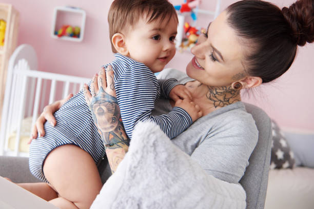 istock Mother holding toddler in arms 655737038