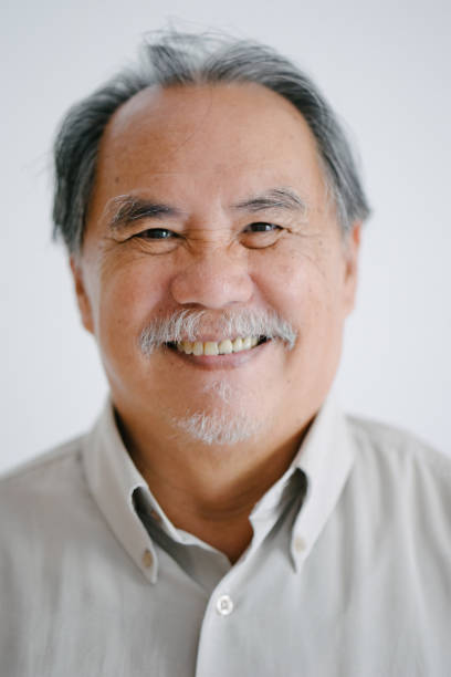 istock Portrait of asian man smiling, white background 655740694