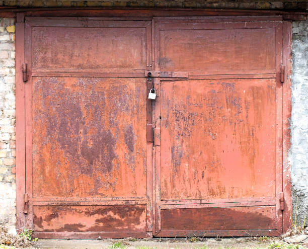istock old metal warehouse door 655745364