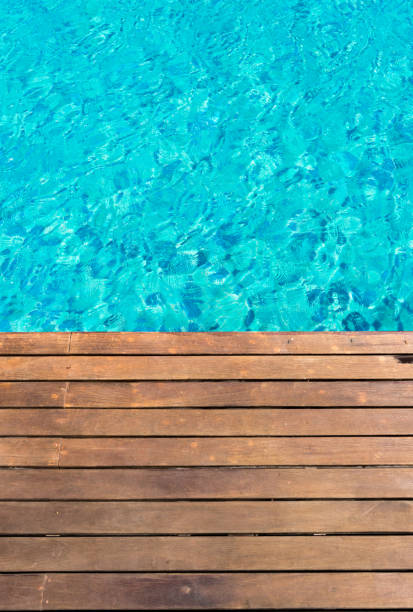 istock wooden platform -swimming pool background 655748664