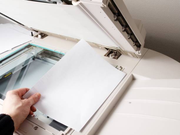 istock Person handling a photocopier 655749030