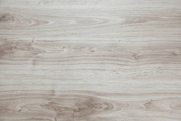 istock Wooden background with light and gray patches. Laminate. 655749126