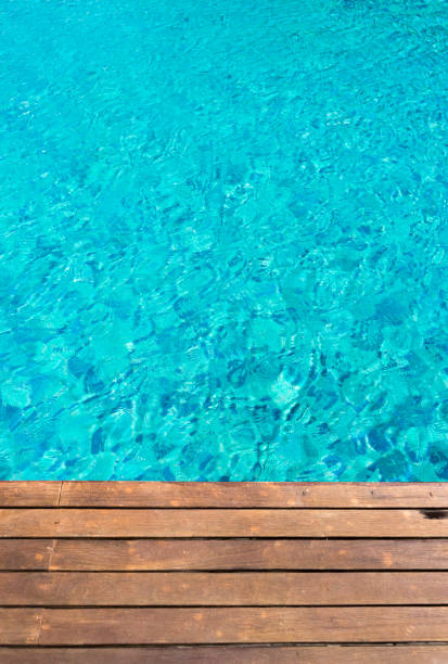 istock wooden platform -swimming pool background 655749292