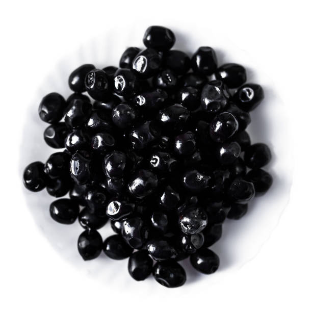 istock Black olives on a white plate isolated on white background 655749602