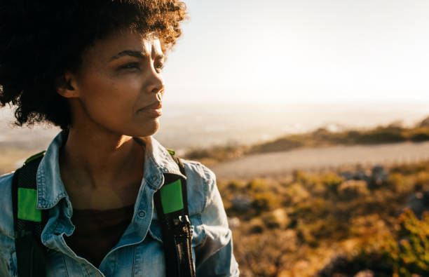 istock Young african female hiker standing in nature 655749778