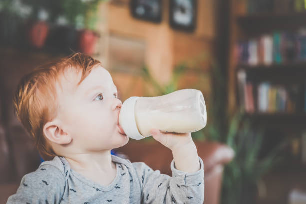 Baby Boy drinking Milk Bottle