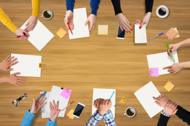 istock Business people group works at a table - wood 655761212