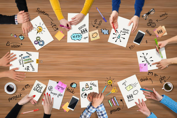 istock Business people group works at a table - wood 655761214