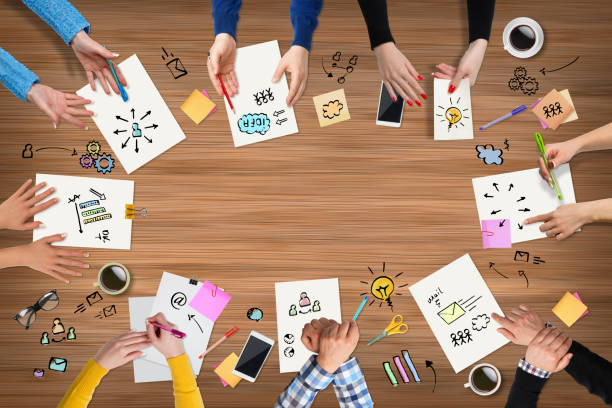 istock Business people group works at a table - wood 655761218