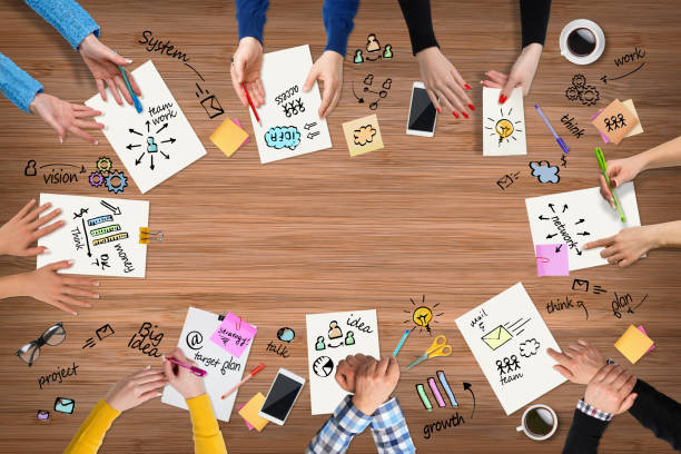 istock Business people group works at a table - wood 655761220