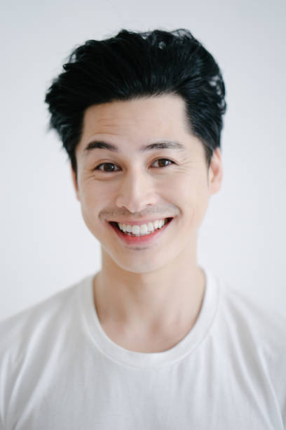 istock Portrait of asian man smiling, white background 655762094