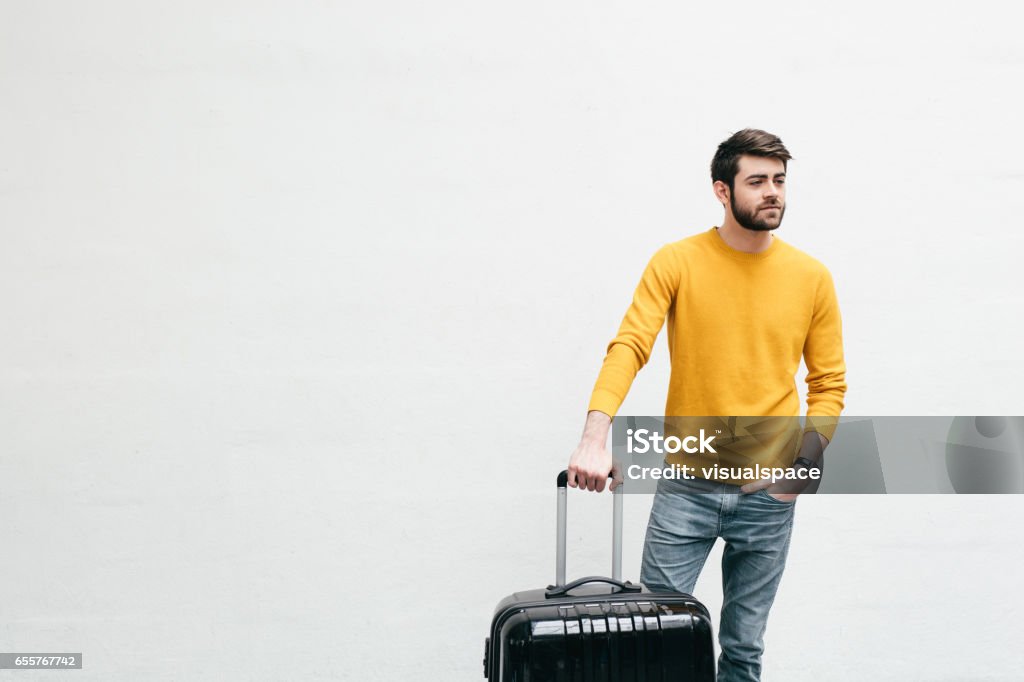 Friends Going Travelling Friends are meeting in a white room. As there are three people in this situation, a little drama and comedy is all natural. Luggage Stock Photo