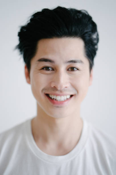 istock Portrait of asian man smiling, white background 655770342