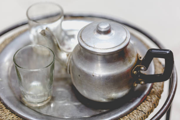 Berber man offers traditional mint tea to guest in Marrakesh, Morroco