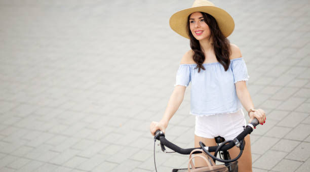 istock Healthy beautiful woman riding bicycle 655771608