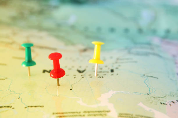 istock pins attached to map, showing location or travel destination 655771742