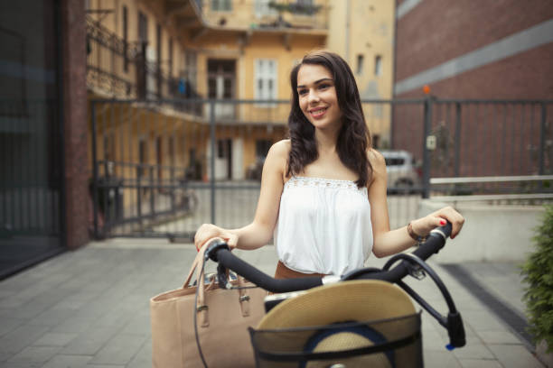 istock Healthy beautiful woman riding bicycle 655772310