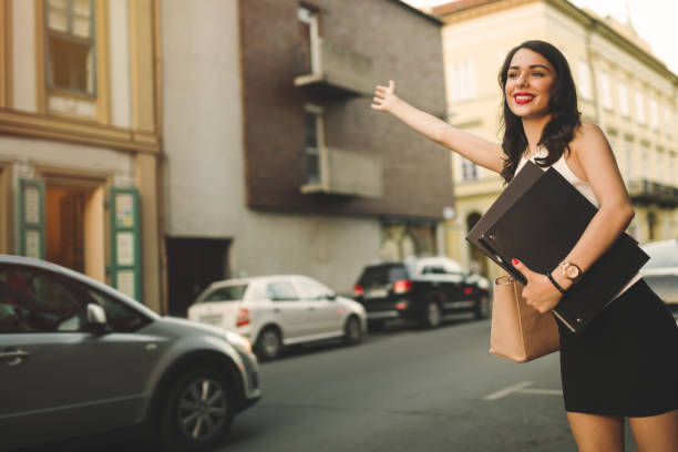 istock Happy businesswoman hailing cab 655772680