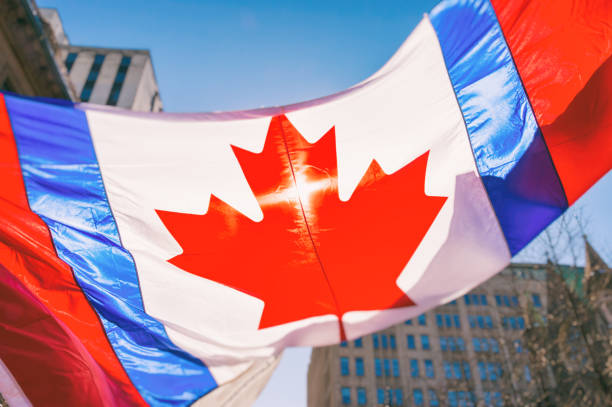 istock Canadian Flag shot into the sun 655772810