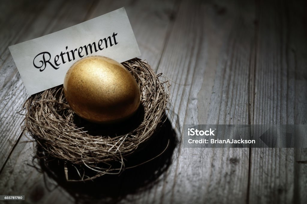 Retirement savings golden nest egg Golden nest egg concept for retirement savings Nest Egg Stock Photo