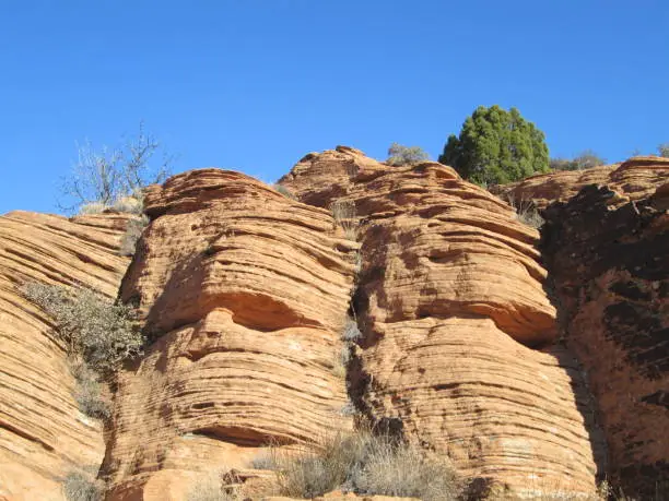 natural rock formation resembling mummy faces