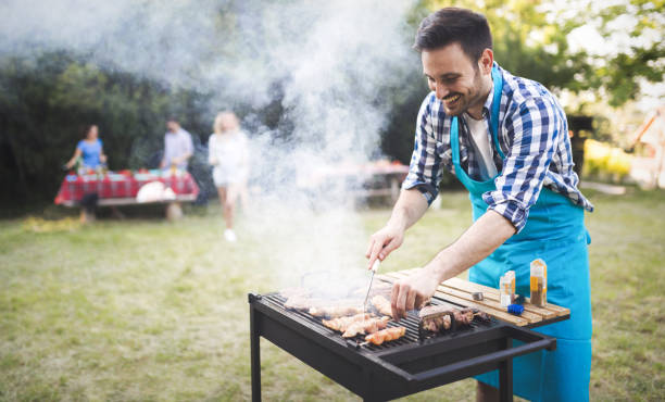 istock Friends having fun grilling meat enjoying bbq party 655785268