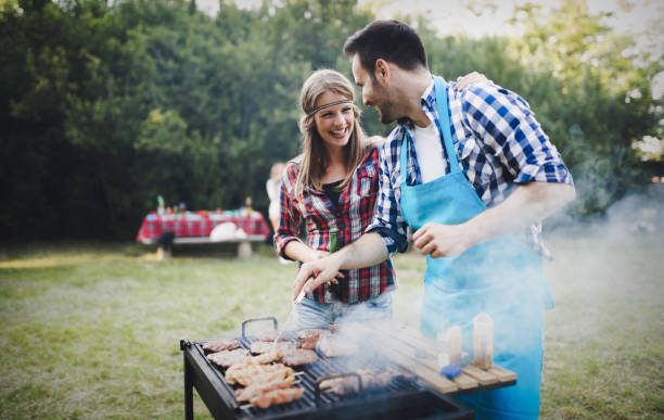 istock Friends having fun grilling meat enjoying bbq party 655785476