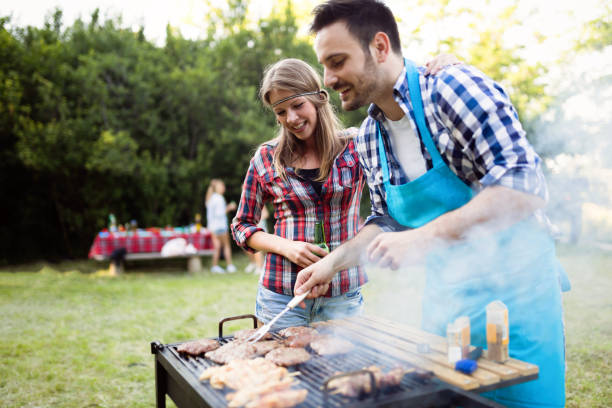 istock Happy outgoing people enjoying bbq and grilling meat 655785808