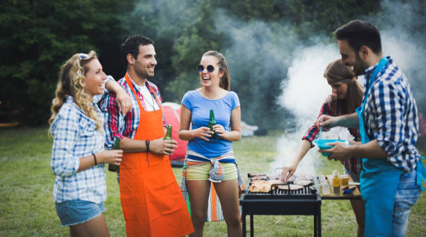 istock Friends having fun grilling meat enjoying bbq party 655786022