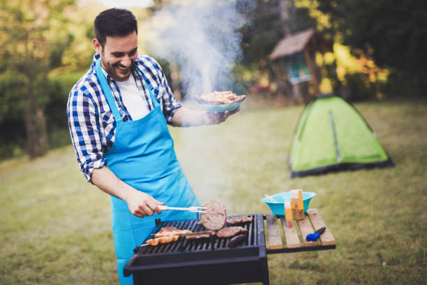 istock Handsome man preparing barbecue for friends outdoor 655786198