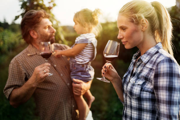 istock Winemaker family happy together in vineyard before harvesting 655794602
