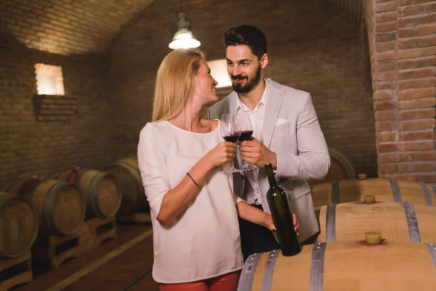 istock Wine loving couple tasting wines in winery cellar 655798200