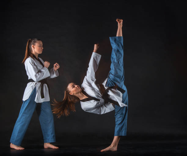 istock The karate girl with black belt 655801096