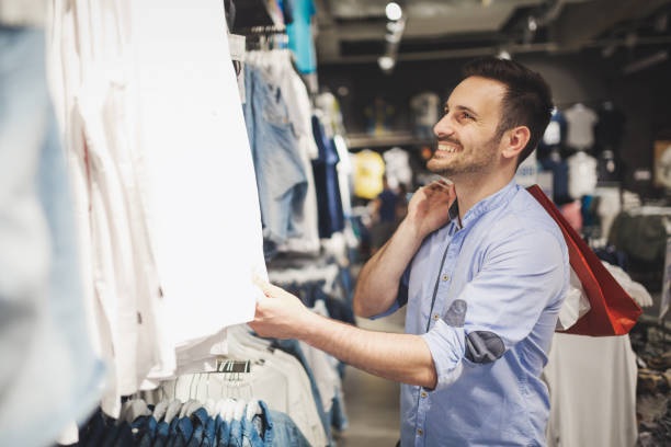 istock Handsome man shopping for new clothes in store 655801514