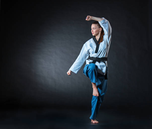 istock The karate girl with black belt 655801614