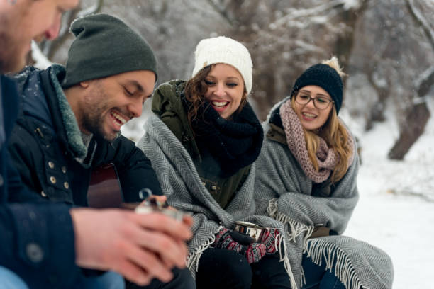 istock Young people playing guitar on winter day 655801672