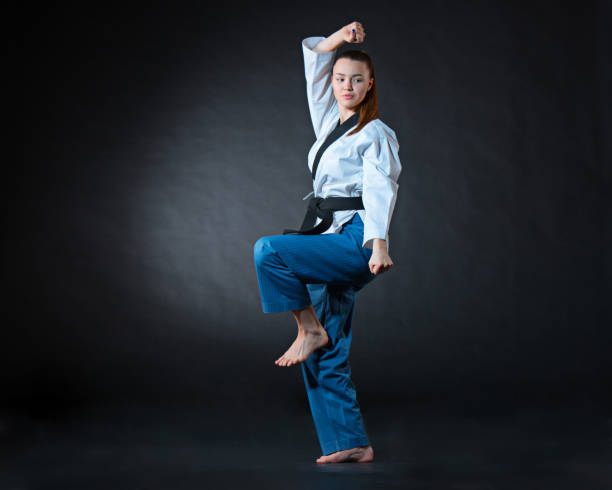 istock The karate girl with black belt 655801676
