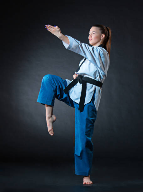istock The karate girl with black belt 655801772