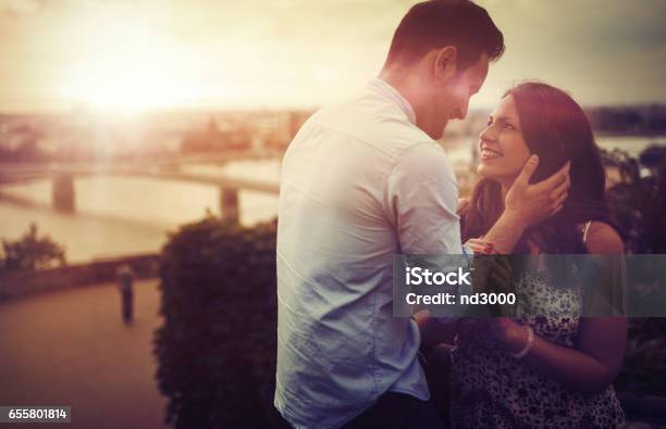 Romantic Couple Dating And Being Romantic During Sunset Stock Photo - Download Image Now