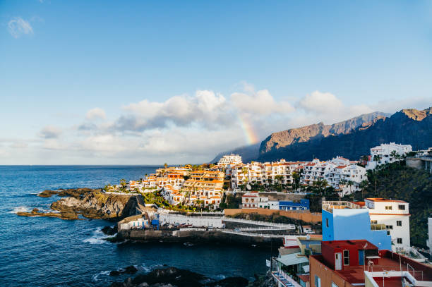 istock Rainbow over resorts of Puerto Santiago, Tenerife 655802428