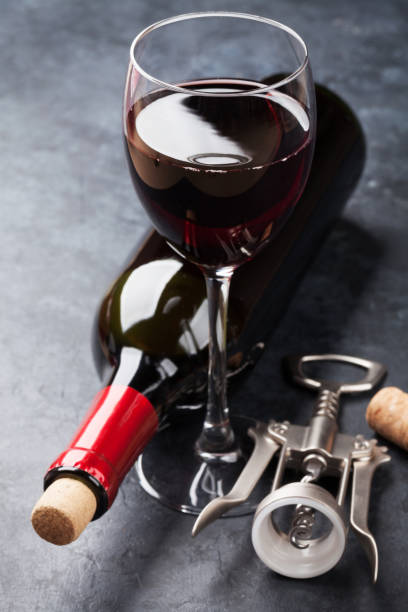 istock Red wine glass and bottle 655807804
