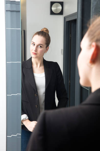 istock beautiful young business woman preparing herself for confident morning routine 655810634