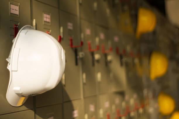 istock Safety helmet hanging on locker 655814990