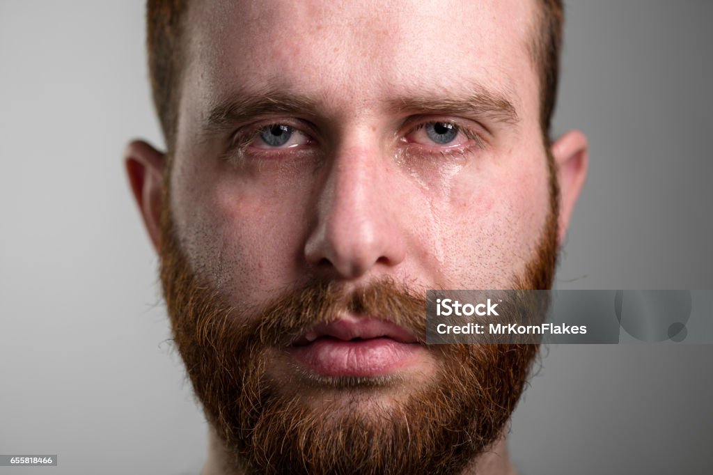 Crying Man Close Up of a Crying Man with Red Beard Crying Stock Photo