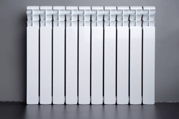 istock White radiator in an apartment 655818634