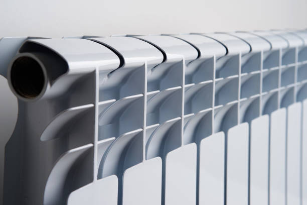 istock White radiator in an apartment 655818664