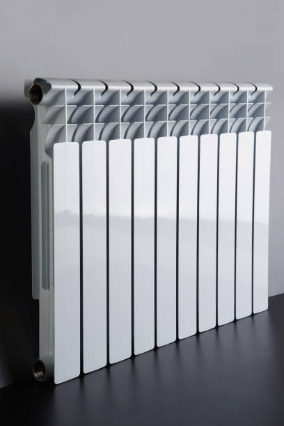 istock White radiator in an apartment 655819610