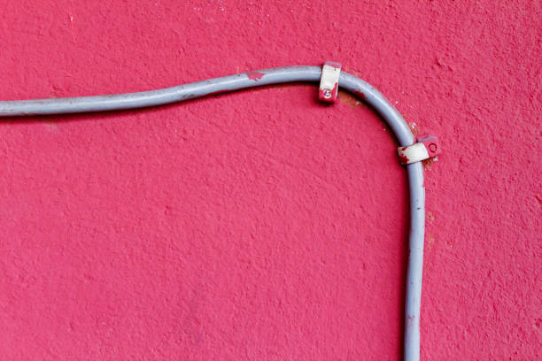 istock Ethernet cable attached to the wall. Abstract background 655820058