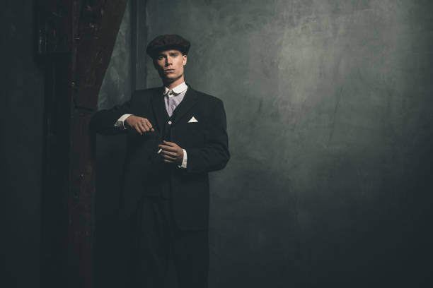 istock Retro 1920s english gangster standing with cigarette. 655820594