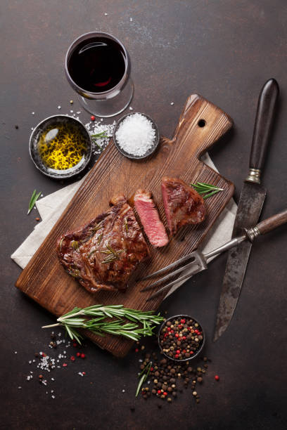 istock Grilled ribeye beef steak with red wine, herbs and spices 655838314